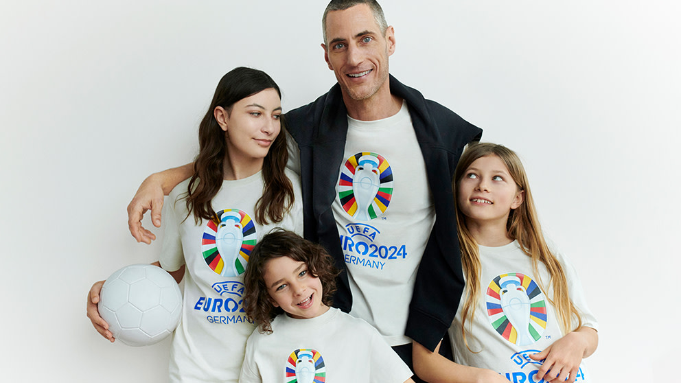 Family wearing matching Euro 2024 football t-shirts. Shop the big match fan zone.