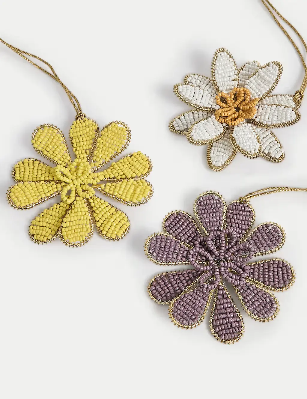 Set of three beaded flower-shaped decorations