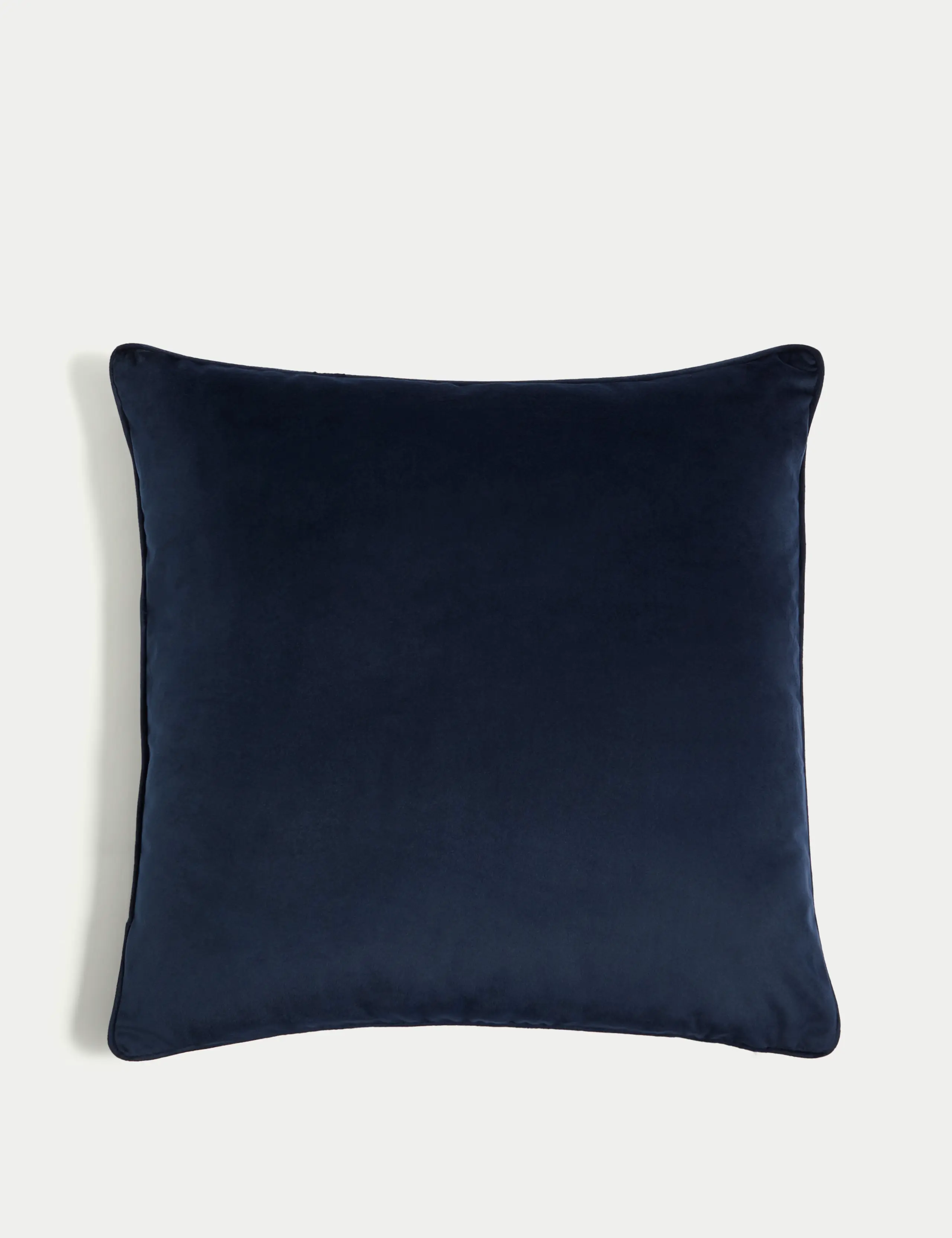 A navy velvet cushion