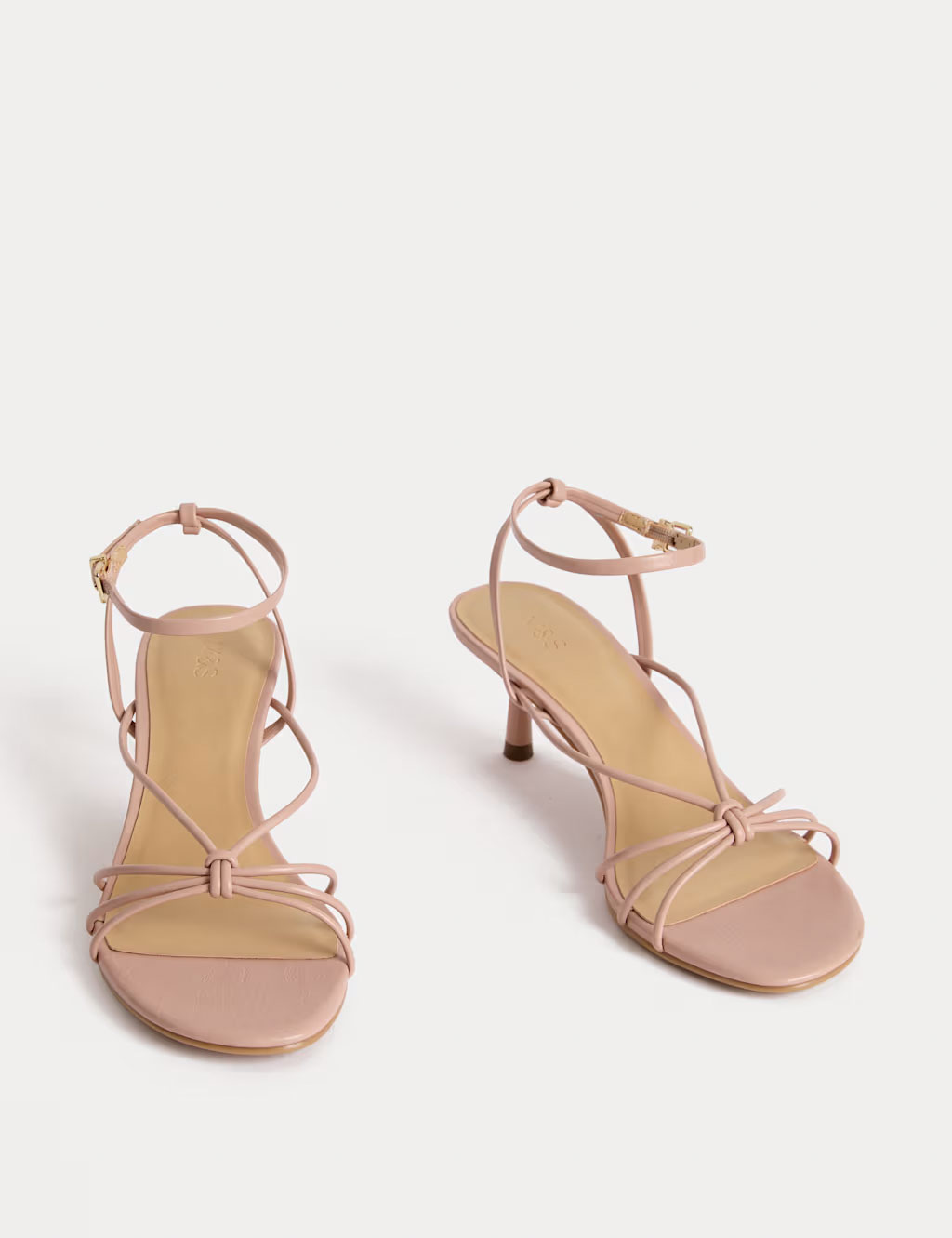 A pair of strappy light pink sandals