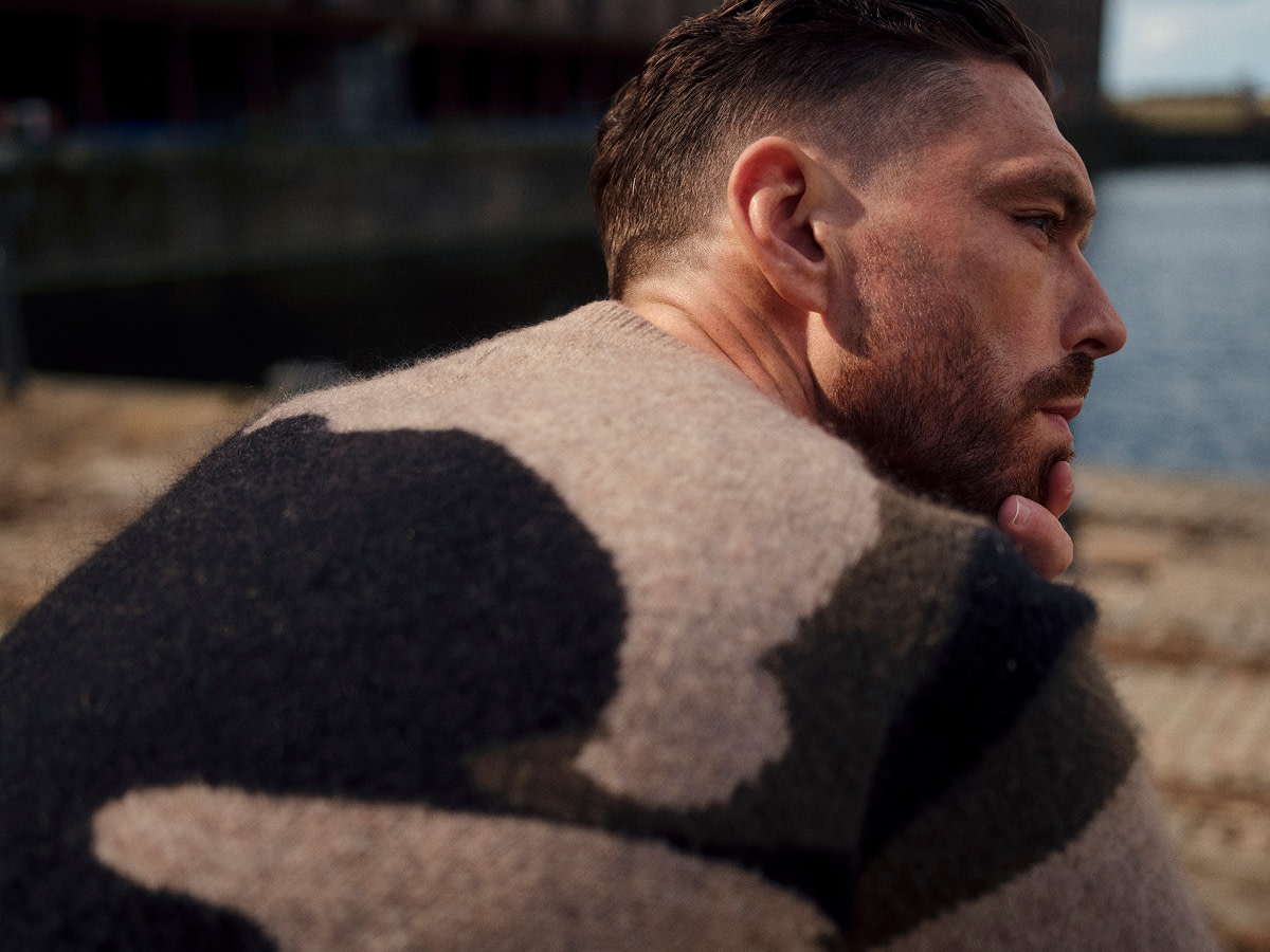 Man wearing wool-rich patterned jumper