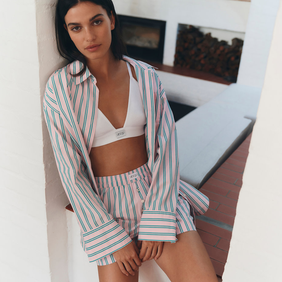 Woman in bra and pyjamas