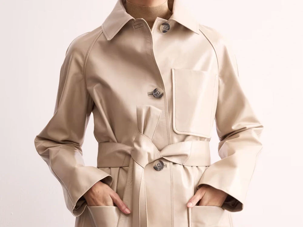 Woman wearing Jaeger cream leather trench coat
