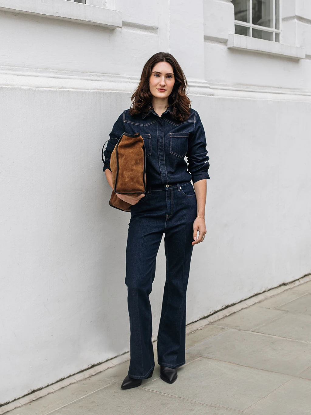 Who What Wear editor Natalie Munro wearing a double-denim outfit by Autograph with a tan suede bag