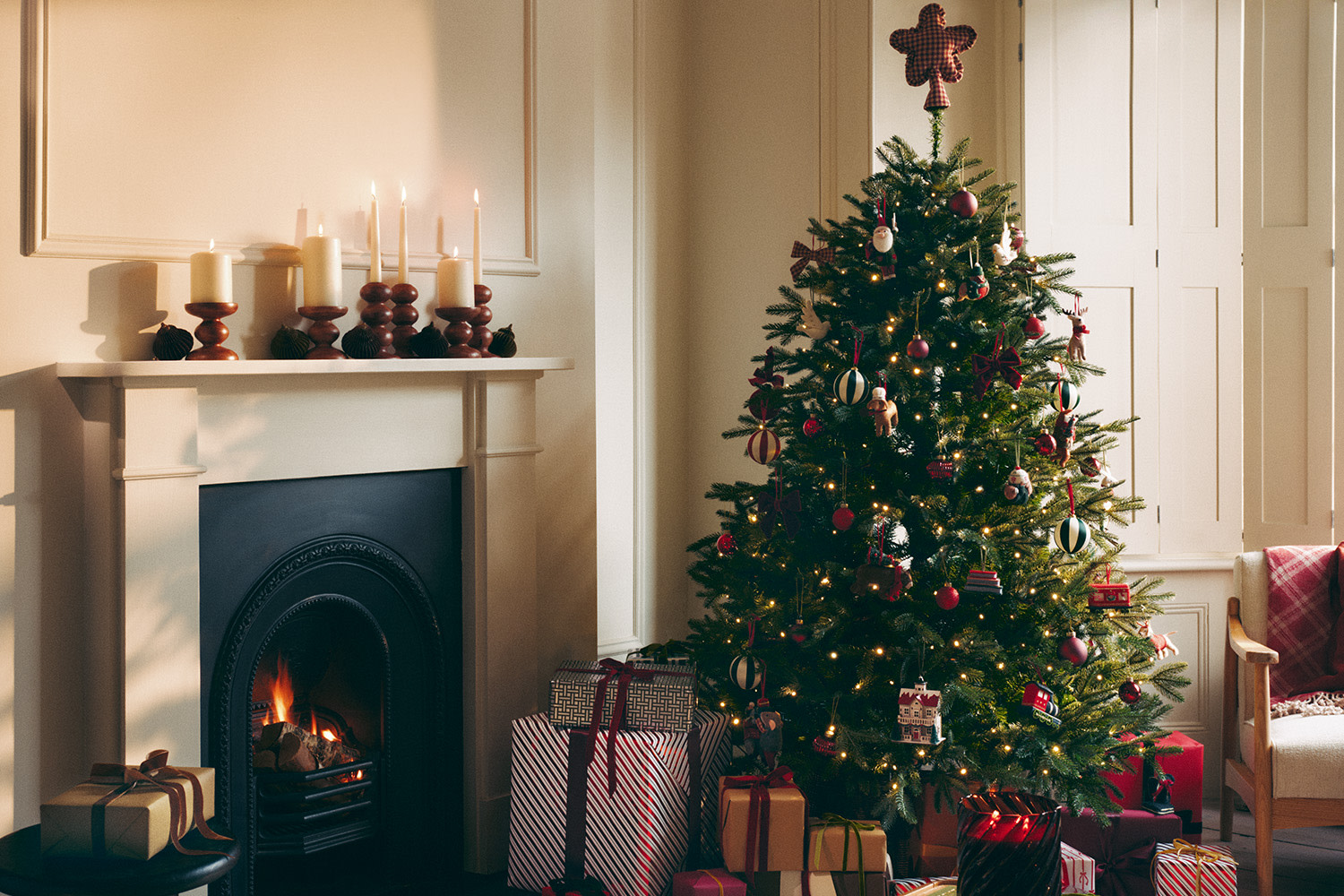 Christmas trees in front of fireplace