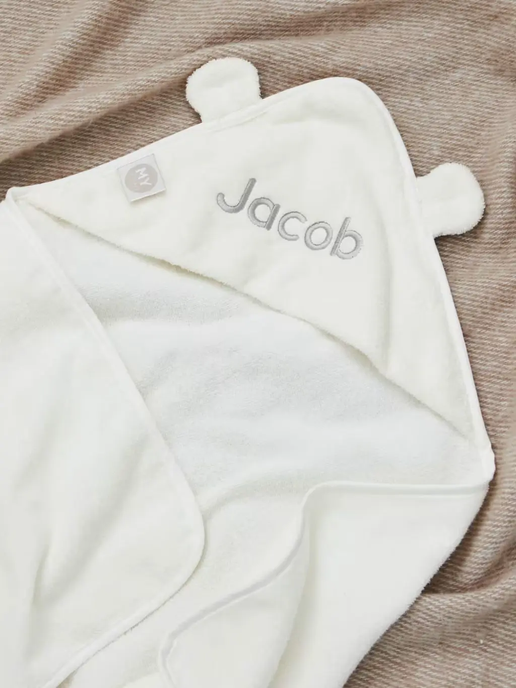 A hooded baby bath towel with ears and personalisation