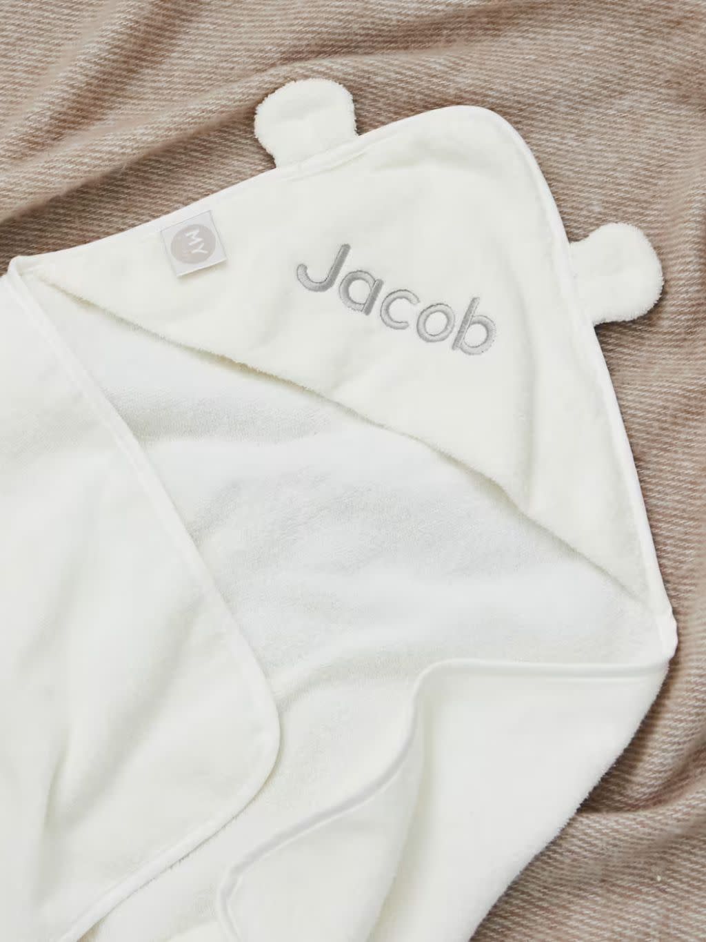A hooded baby bath towel with ears and personalisation