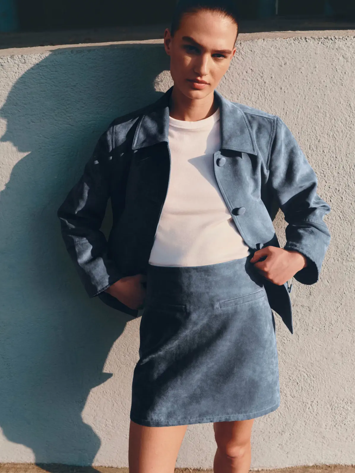 Woman wearing blue suede co-ord
