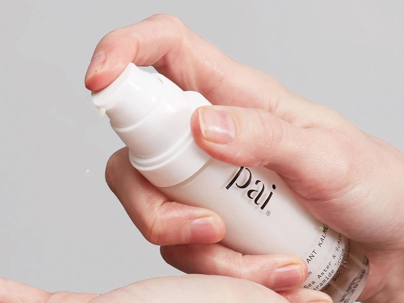 Hands dispensing Pai anti-redness skincare product