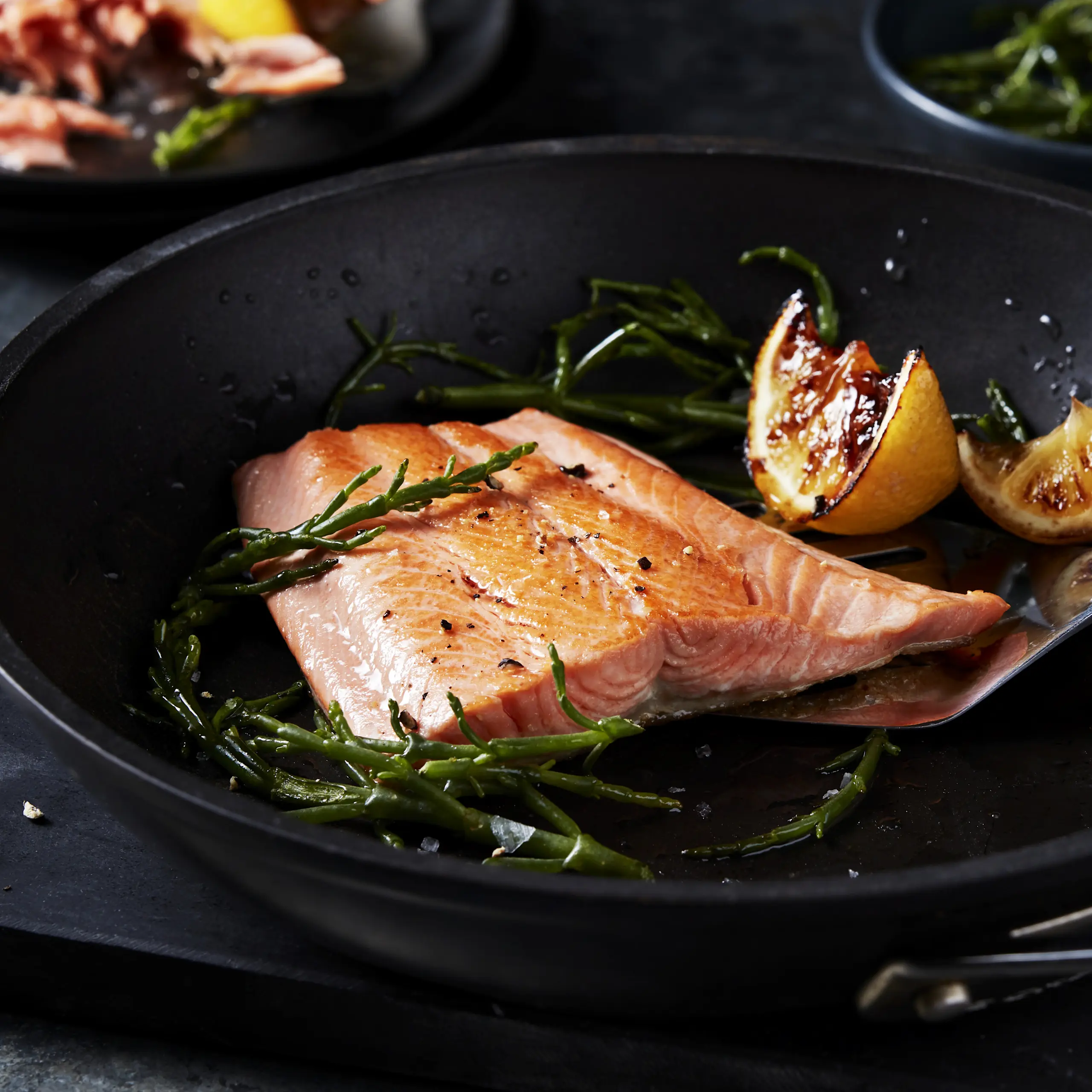 Trout cooking in pan