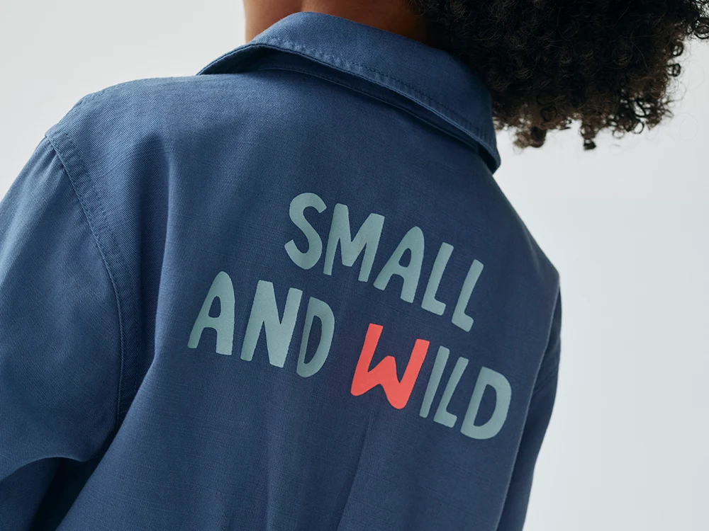 Boy wearing blue jumpsuit from the M&S x Binky collaboration