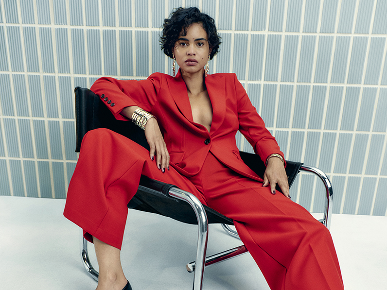 Woman wearing a red Autograph suit