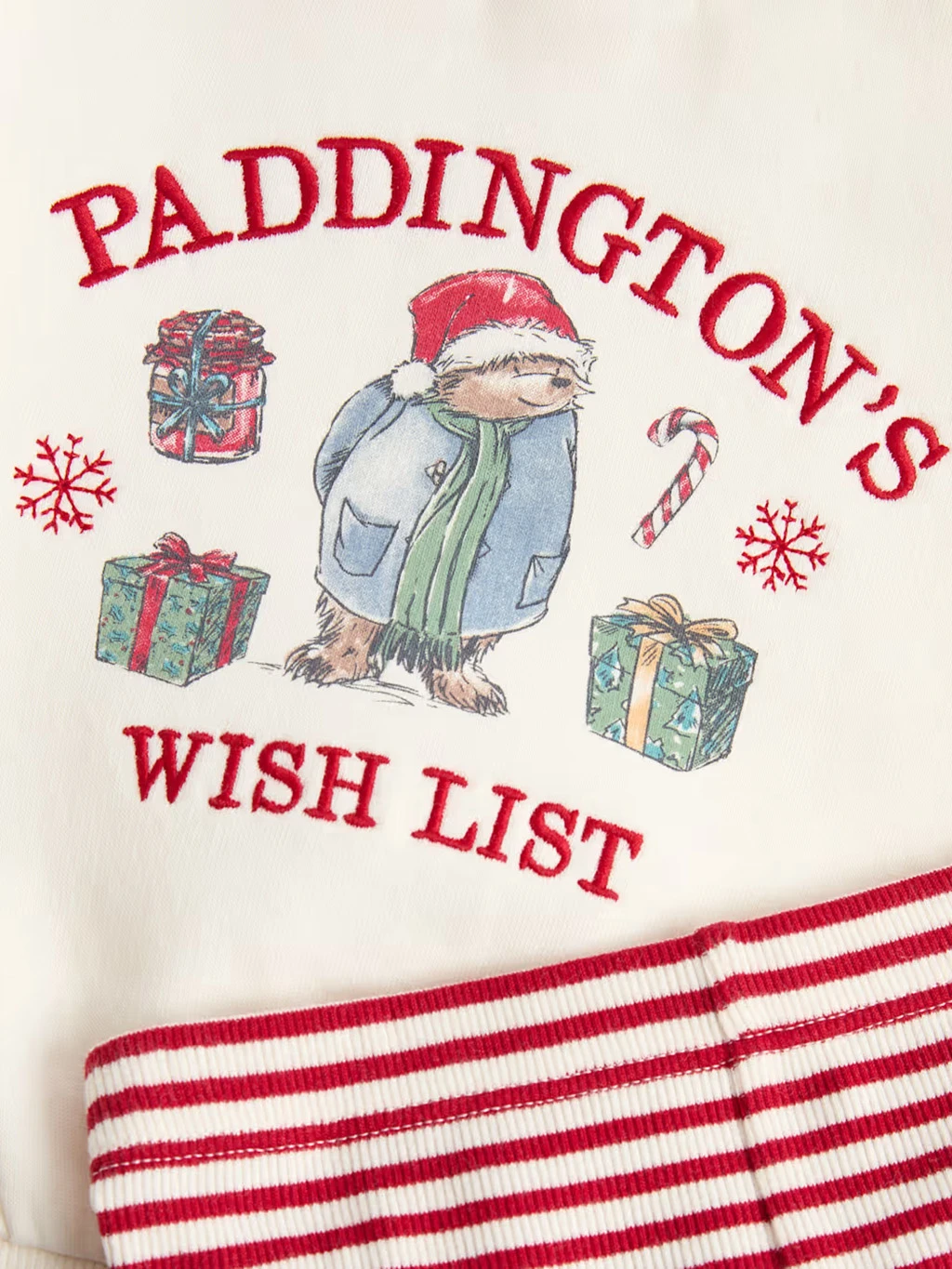 Kids' Paddington pyjamas with a red and white striped legging and embroidered top with a Paddington illustration.