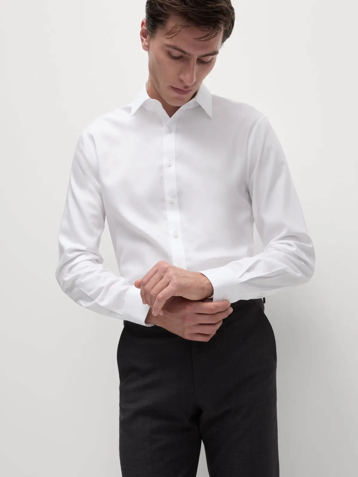 Man wearing white formal shirt and black trousers 