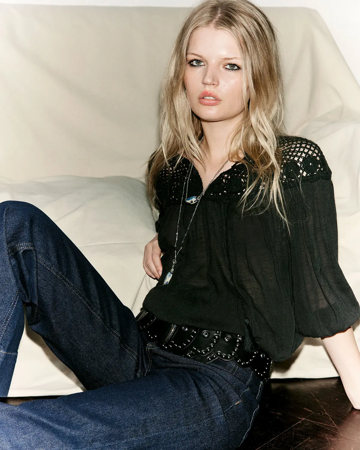 Woman wearing black shirt and dark denim jeans