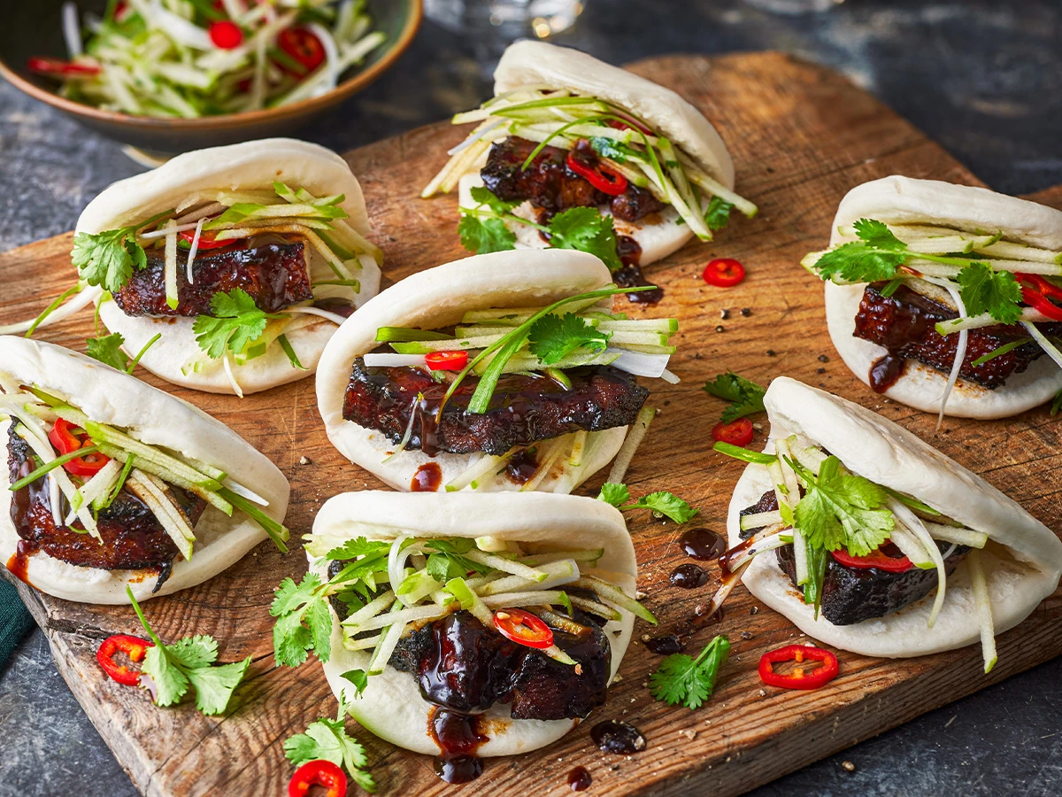 Bao buns filled with hoisin pork and apple