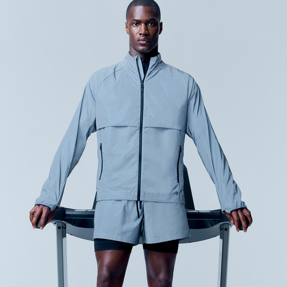 Man wearing light blue sports jacket and shorts