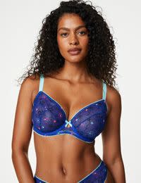 Woman in blue embroidered bra and knickers. Shop 20% off selected Boutique