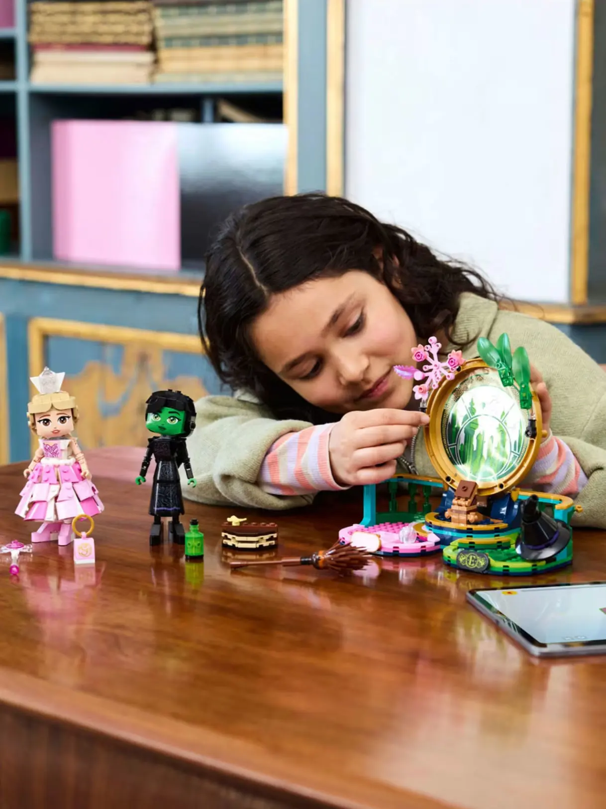 Image of girl playing with Wicked character toys