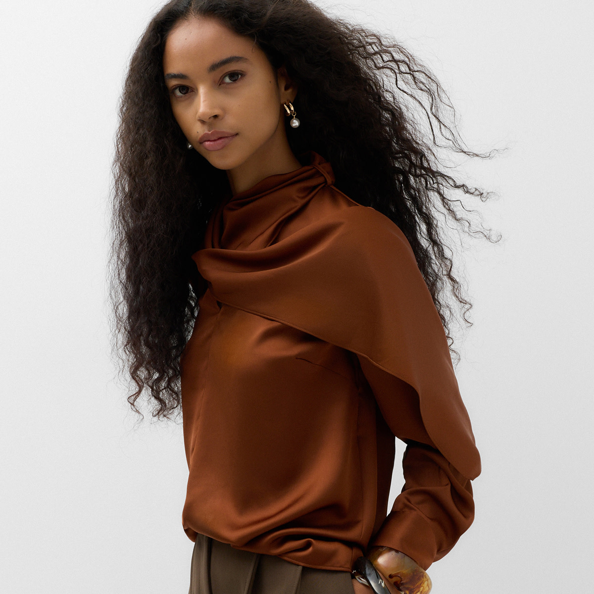 Woman wearing satin blouse
