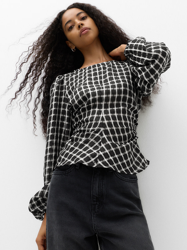 Woman wearing checked top