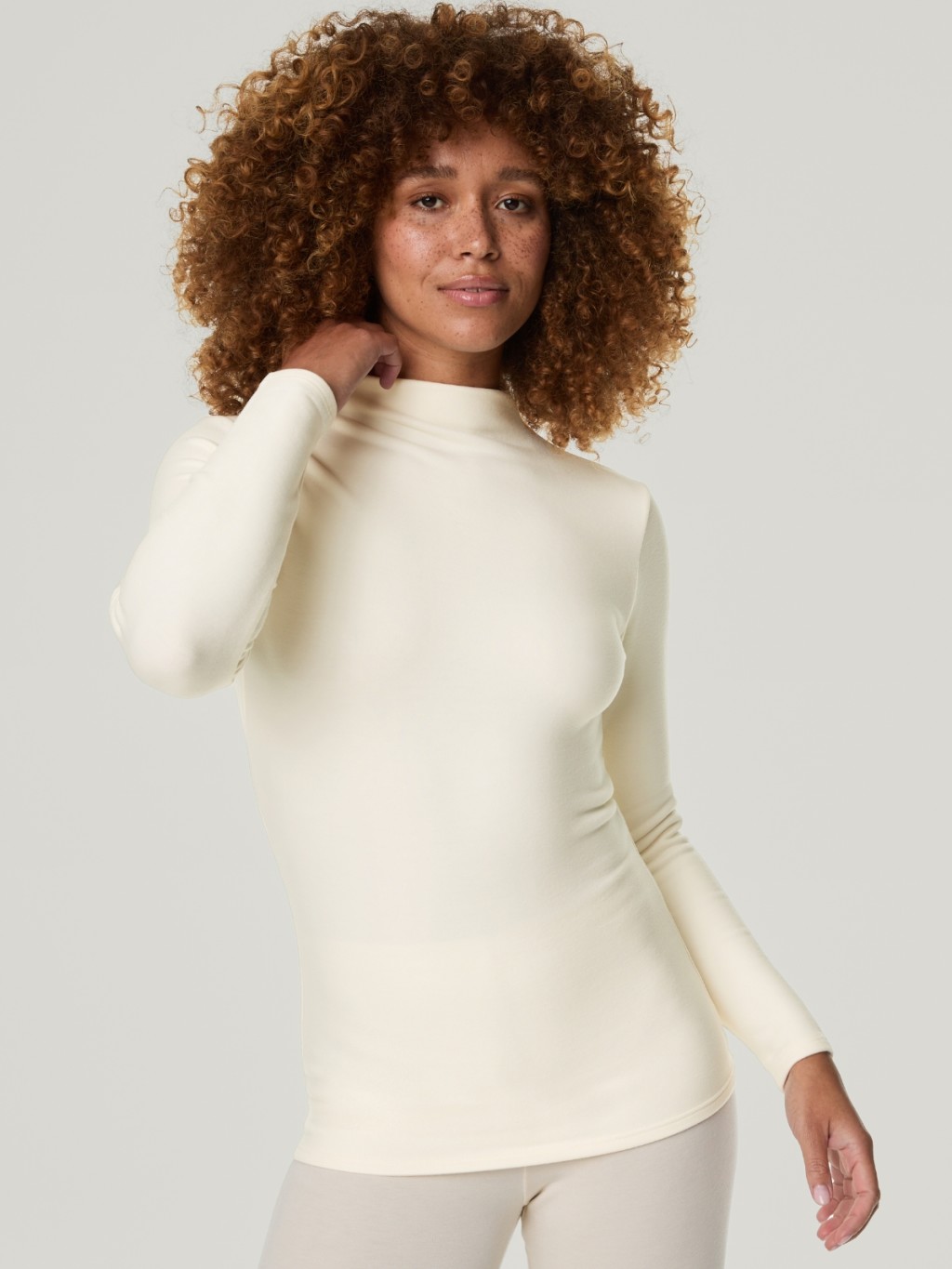 Women wearing a white thermal top. Shop now 