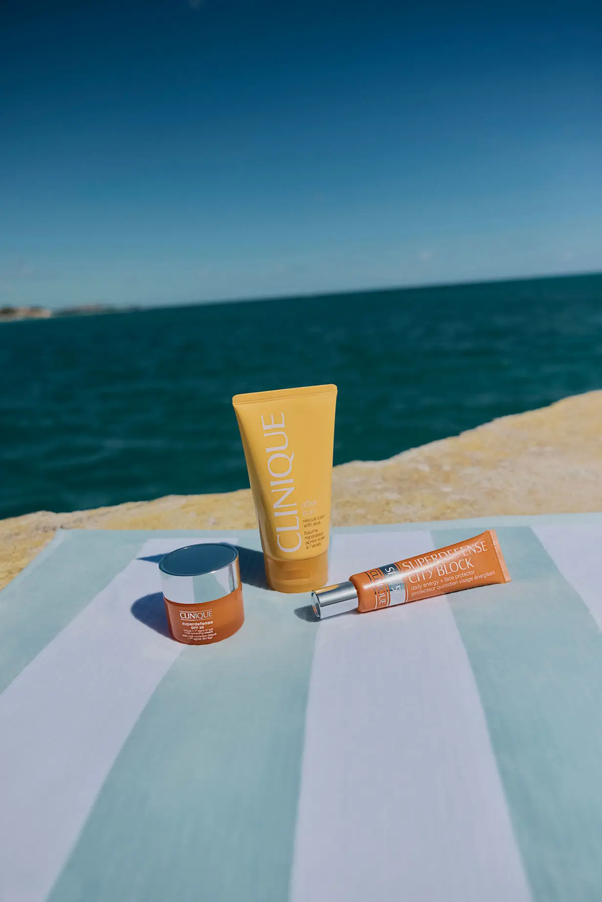 Clinique suncream on the beach

