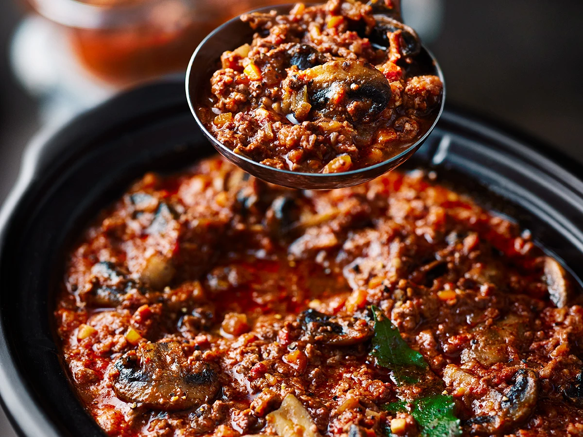 A rich bolognese sauce in a slow cooker 