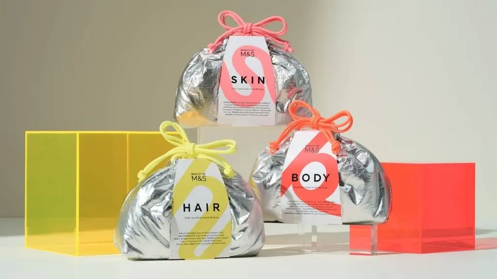 A shot of three silver M&S beauty bags