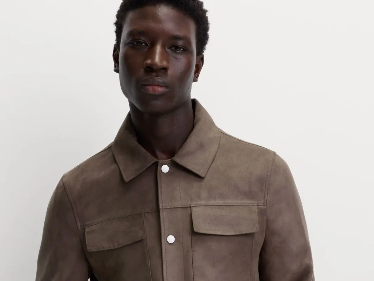 Image of man wearing a brown faux-suede jacket