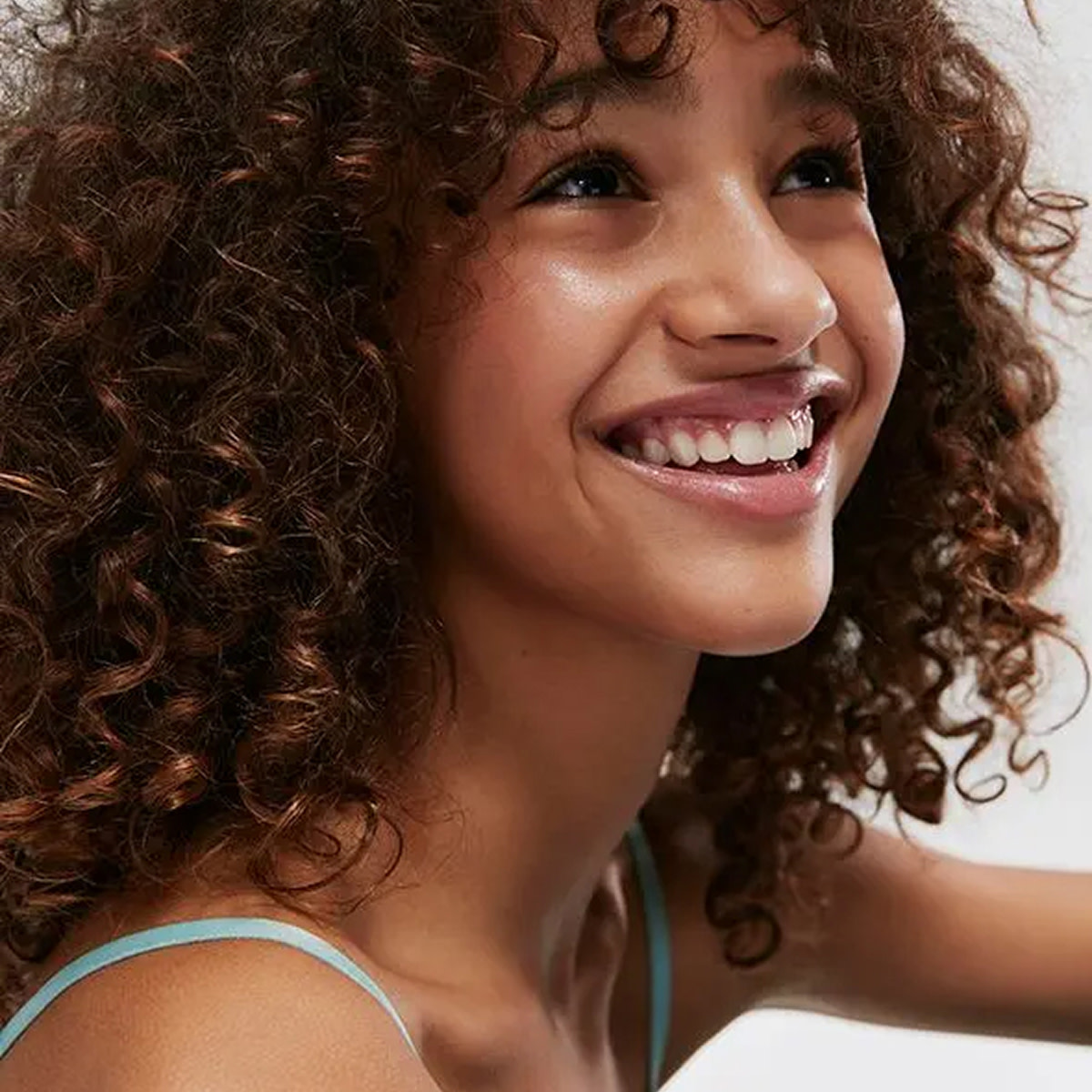 Girl with curly brown hair