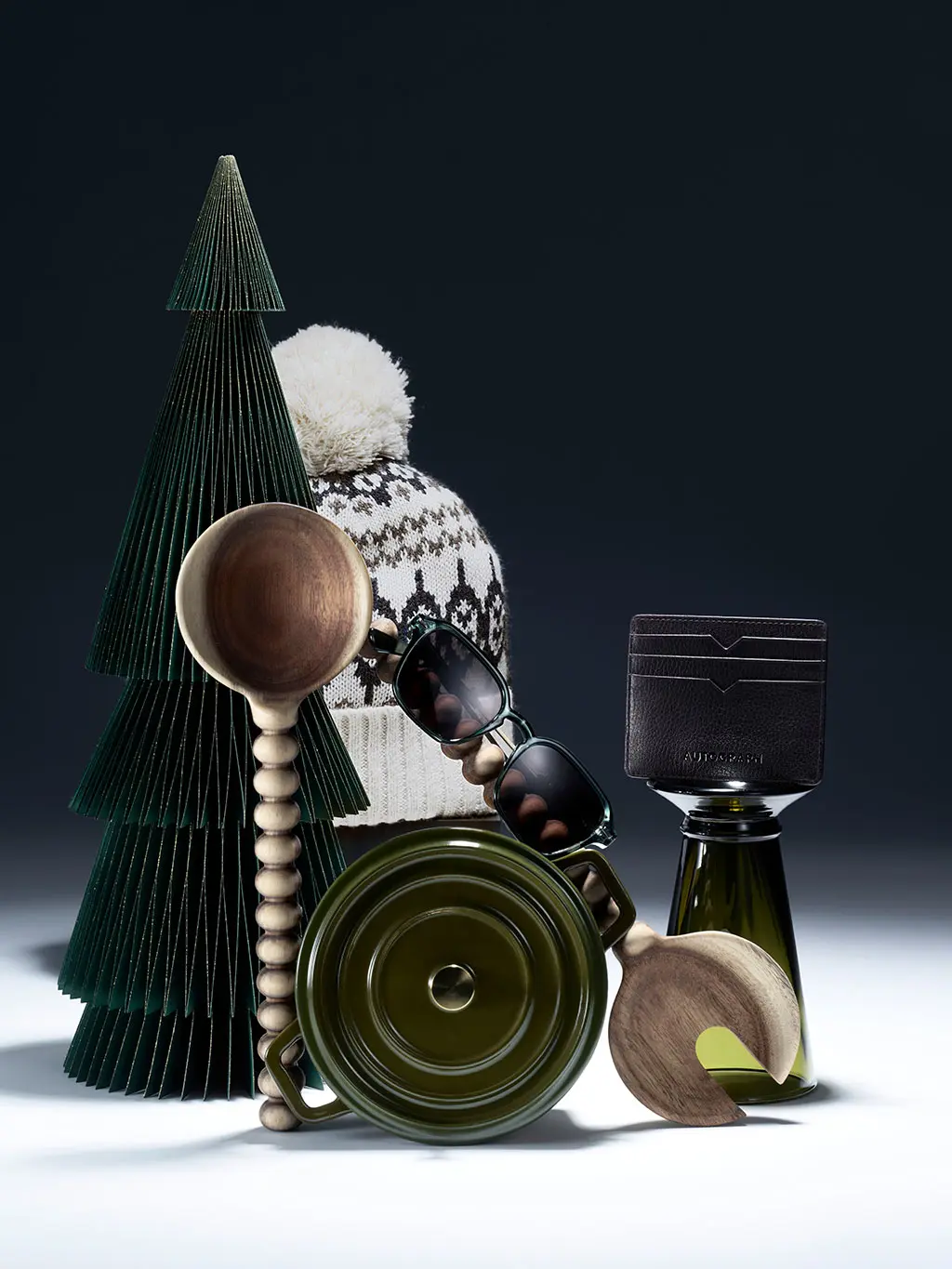 Men's stocking gifts, including a bobble hat, sunglasses, and kitchen accessories