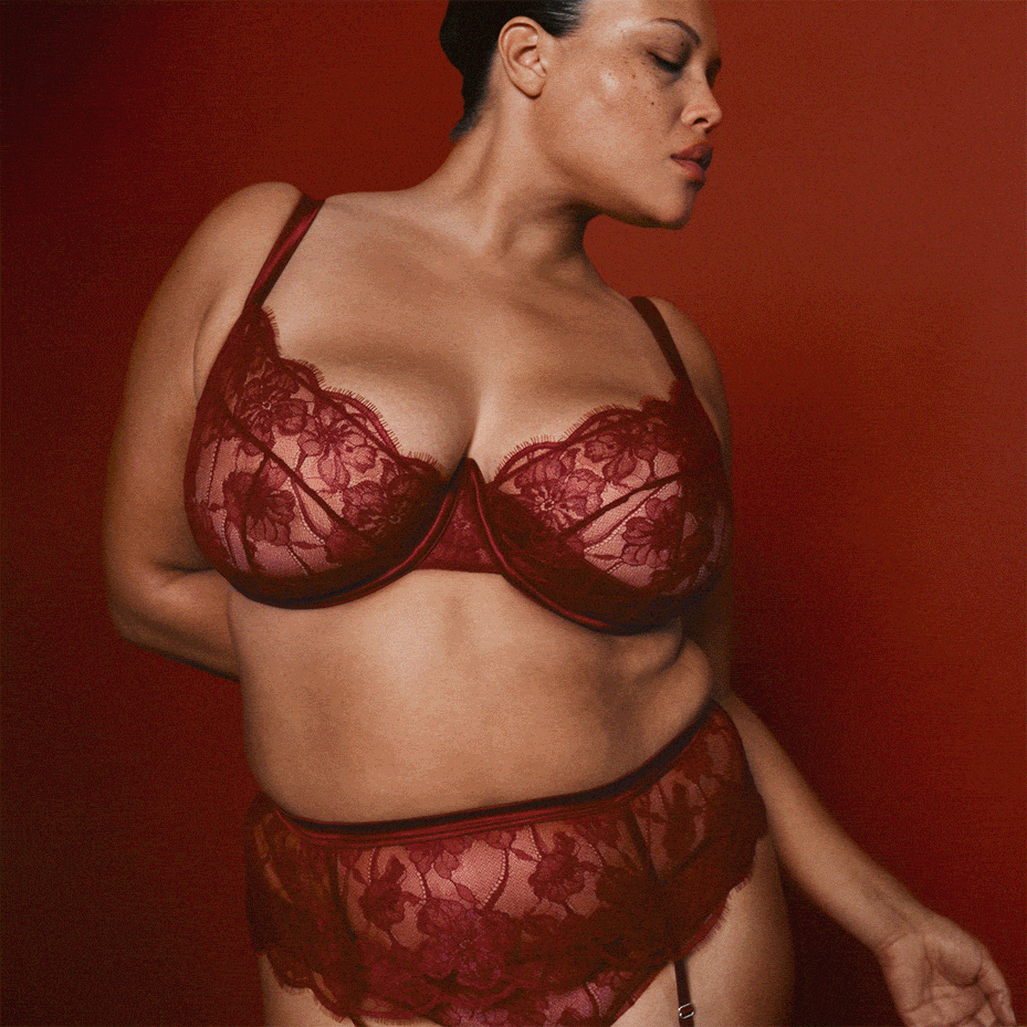 Woman wearing red lace bra and knickers set