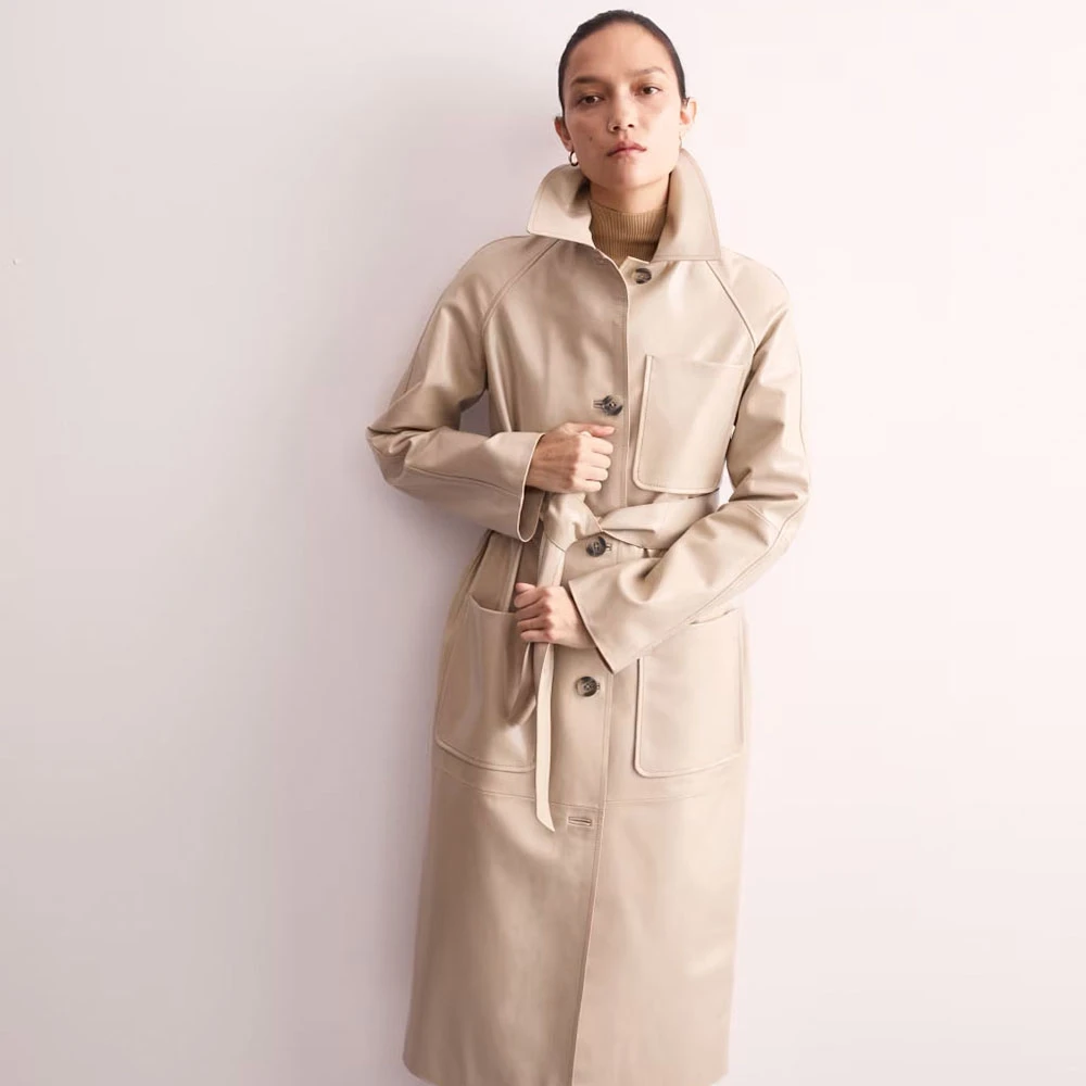 Woman wearing Jaeger cream leather trench coat