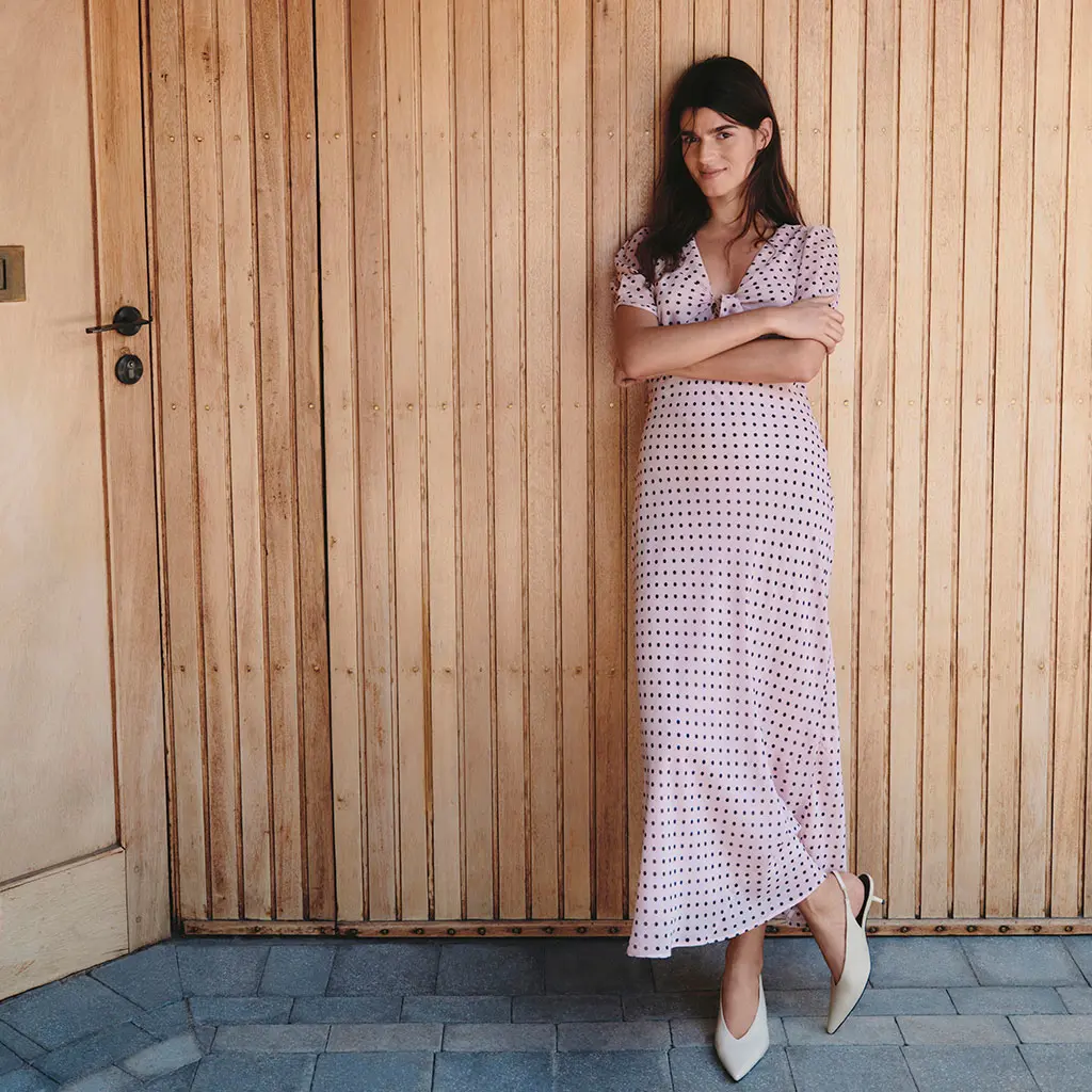 Woman wearing a pink polka-dot dress
