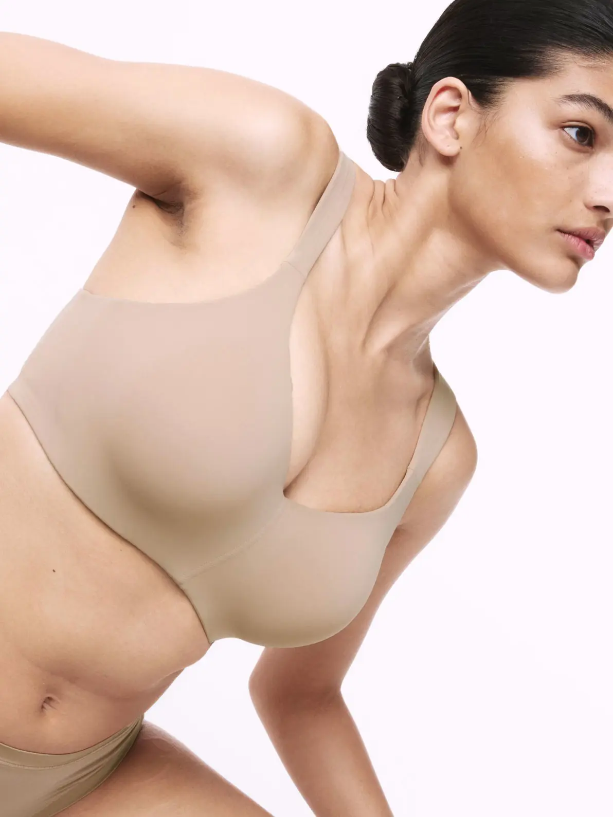 Woman wearing matching nude bra and underwear set 