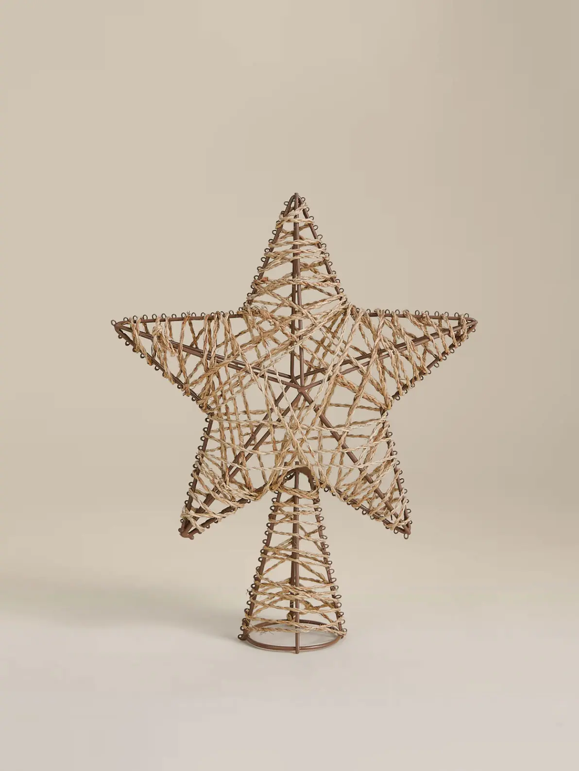 Image of star tree topper made of rattan