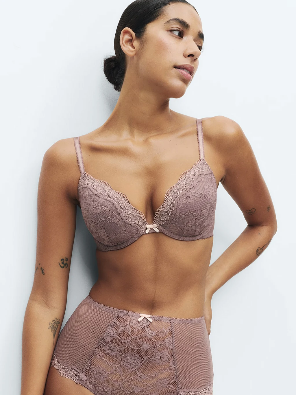 Woman in mauve lace bra