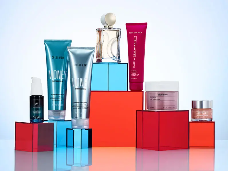 Skincare, makeup and beauty products on orange and blue blocks