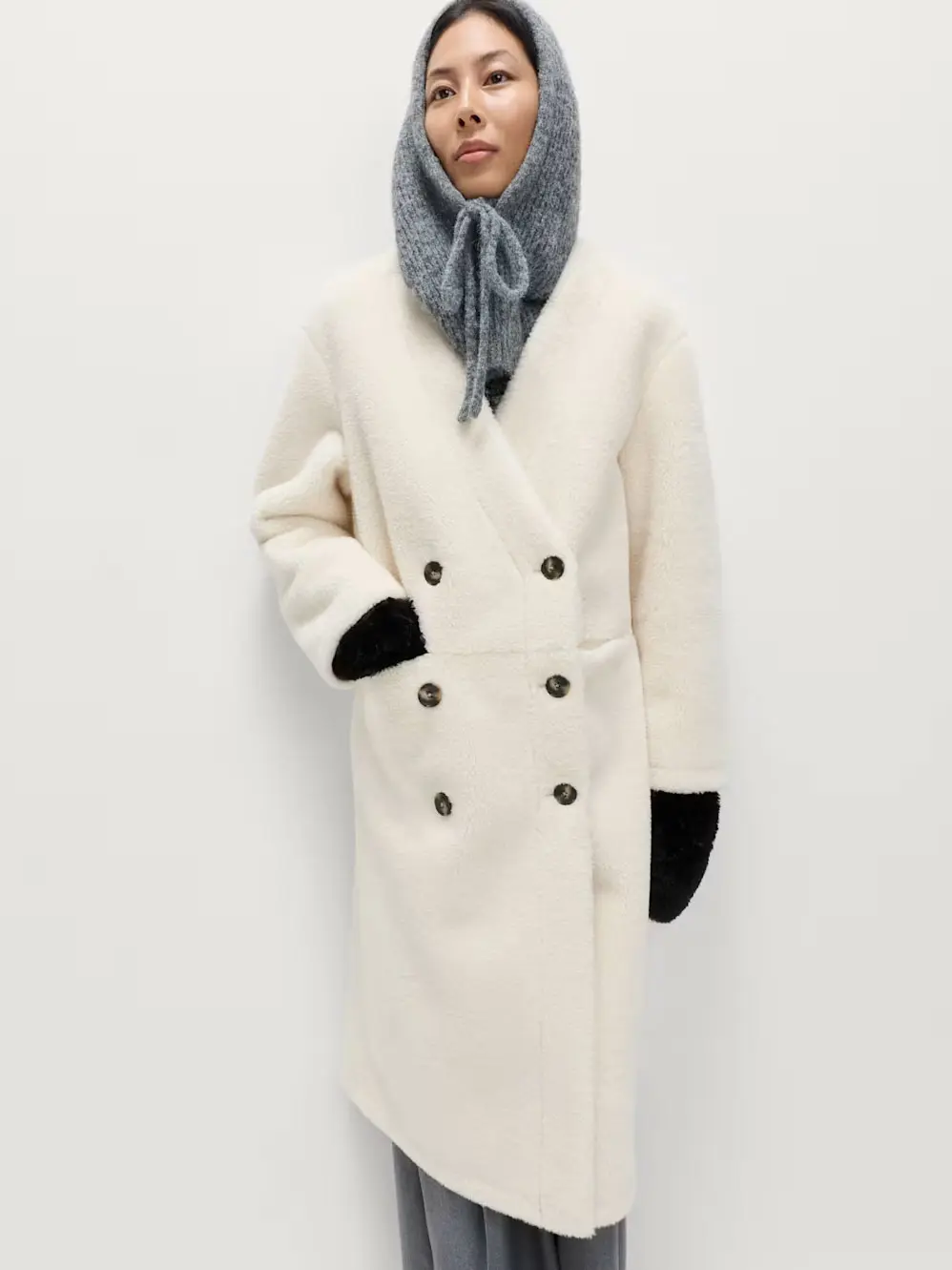 Woman in white coat