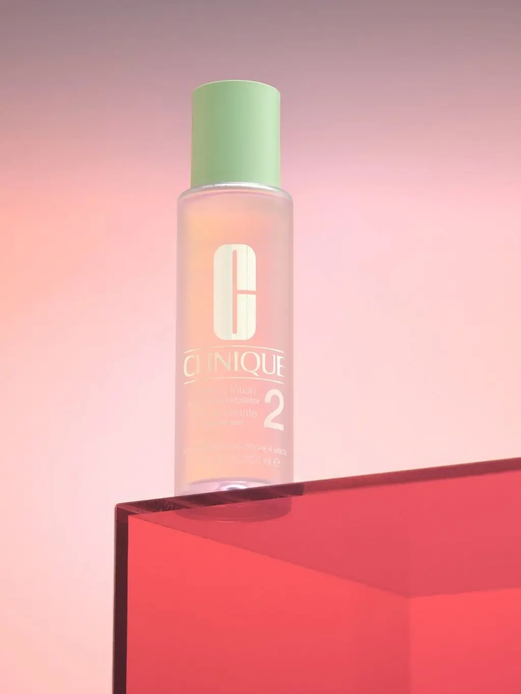 A bottle of Clinique clarifying lotion sat atop a red box