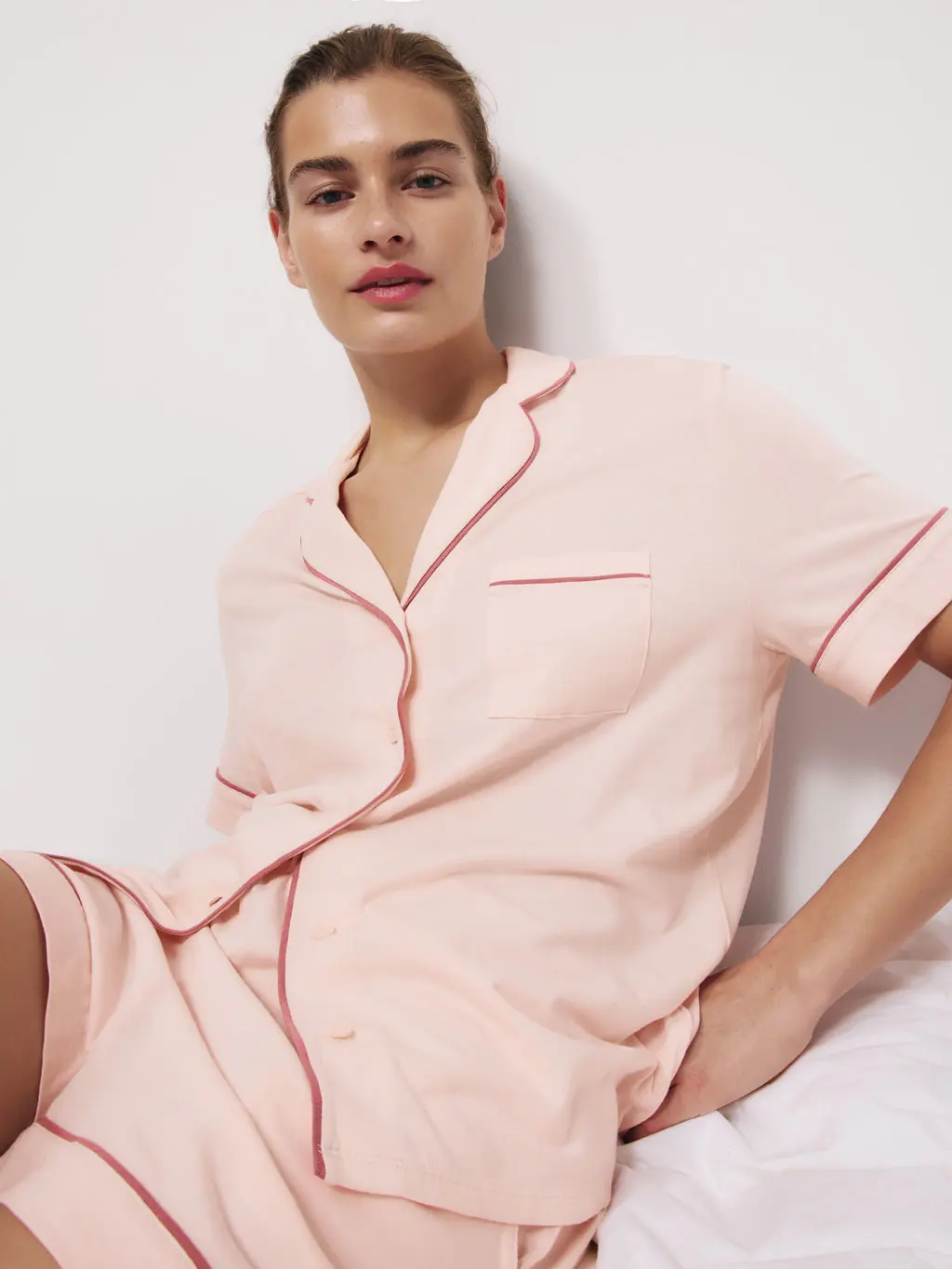 Woman wearing a pink pyjama set