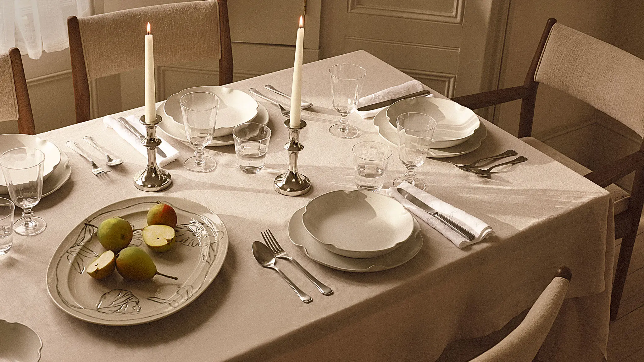 Dining table with plates and candles