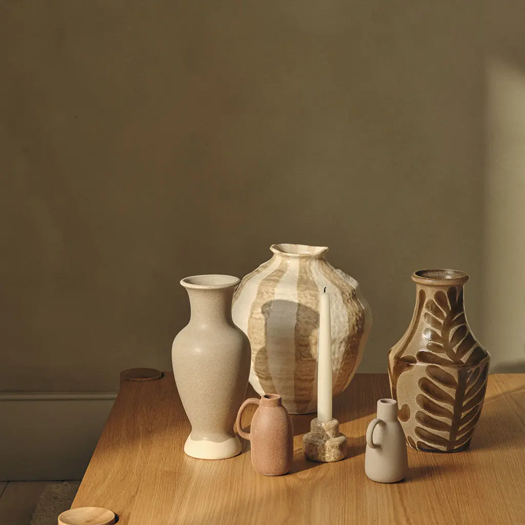 Vases and candles on a table