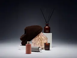 Women's stocking fillers, including slippers, a candle and a room diffuser