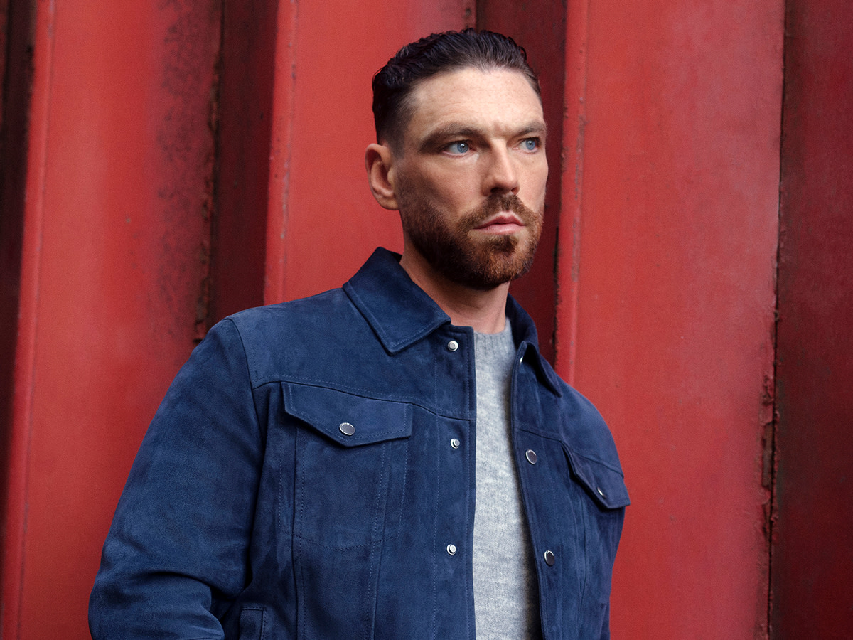 Man wearing blue oversized shirt