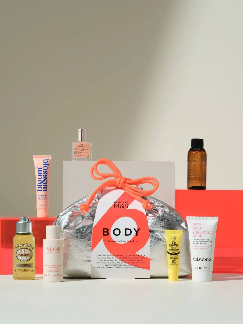 An M&S metallic bodycare bag featuring beauty items for the body