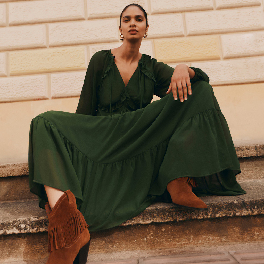 Women wearing a green dresses. 