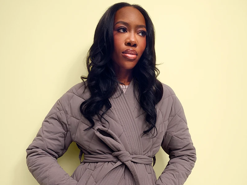 Melissa, the host of Love That, wearing a mauve quilted jacket