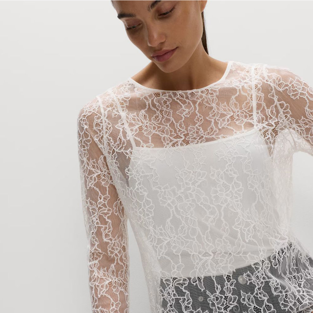Woman wearing white lace top